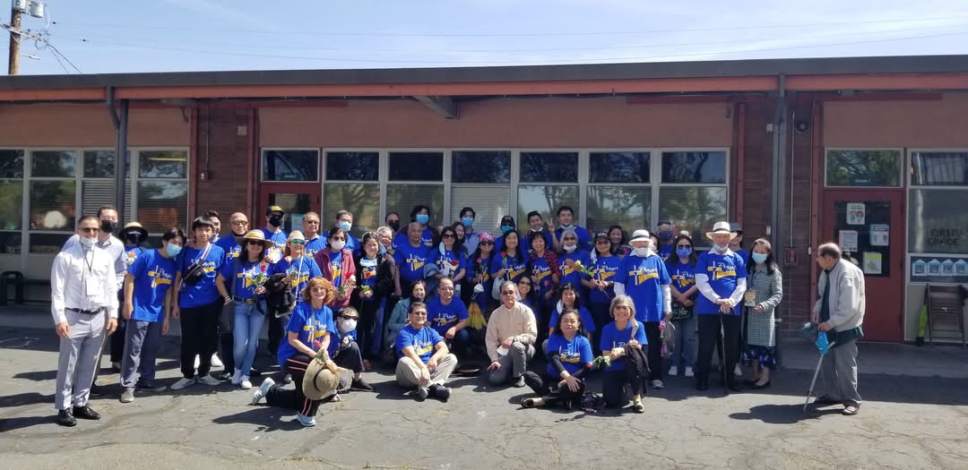 A group of people in blue shirtsAI-generated content may be incorrect.