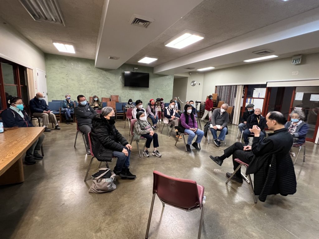 A group of people sitting in chairs in a room

AI-generated content may be incorrect.