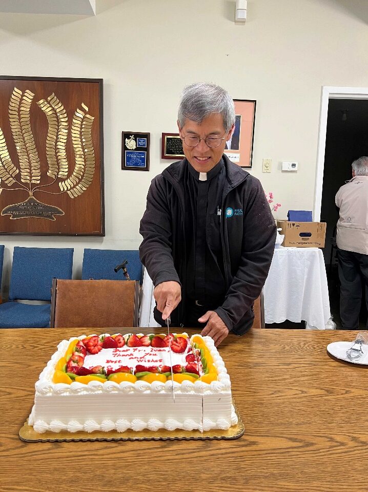 A person cutting a cake

AI-generated content may be incorrect.